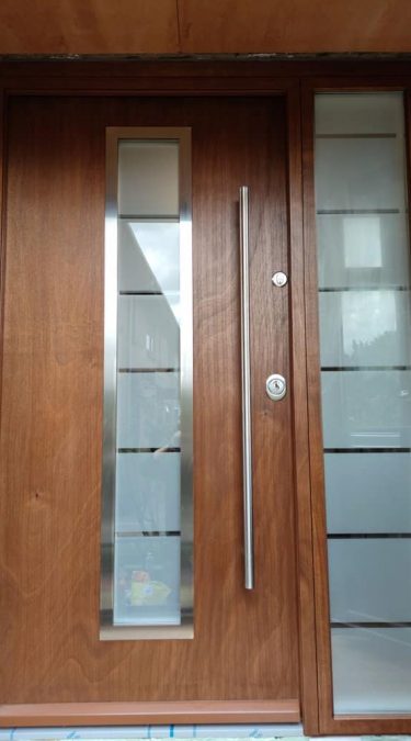 Security Doors with Golden Oak Finish and Sandblasted Glass