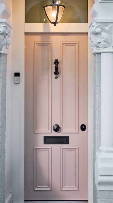 Traditional Security Doors in a Pink Colour with Dark Colour Ironmongery